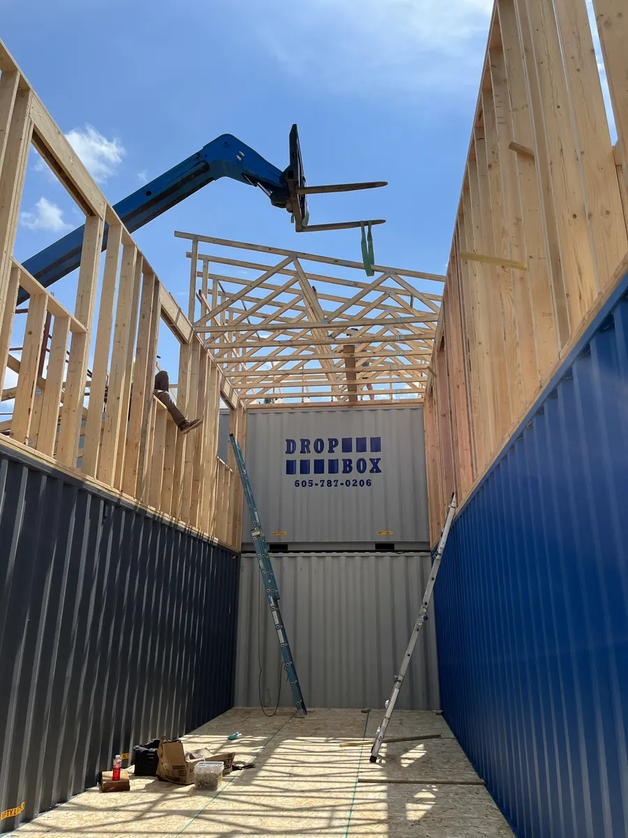 Framing crew raising walls on a Black Hills custom project
