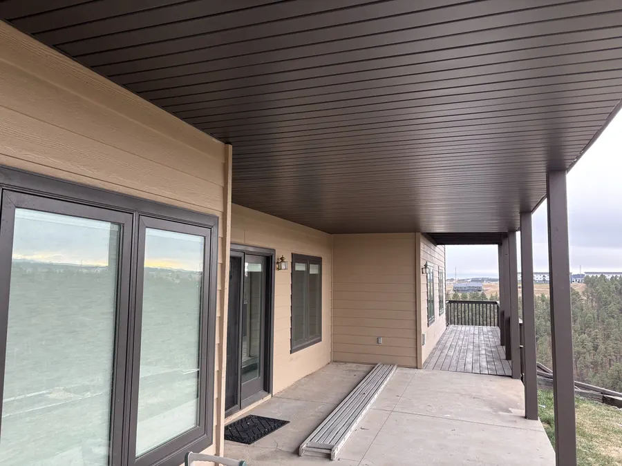 Finished covered patio with metal soffit ceiling