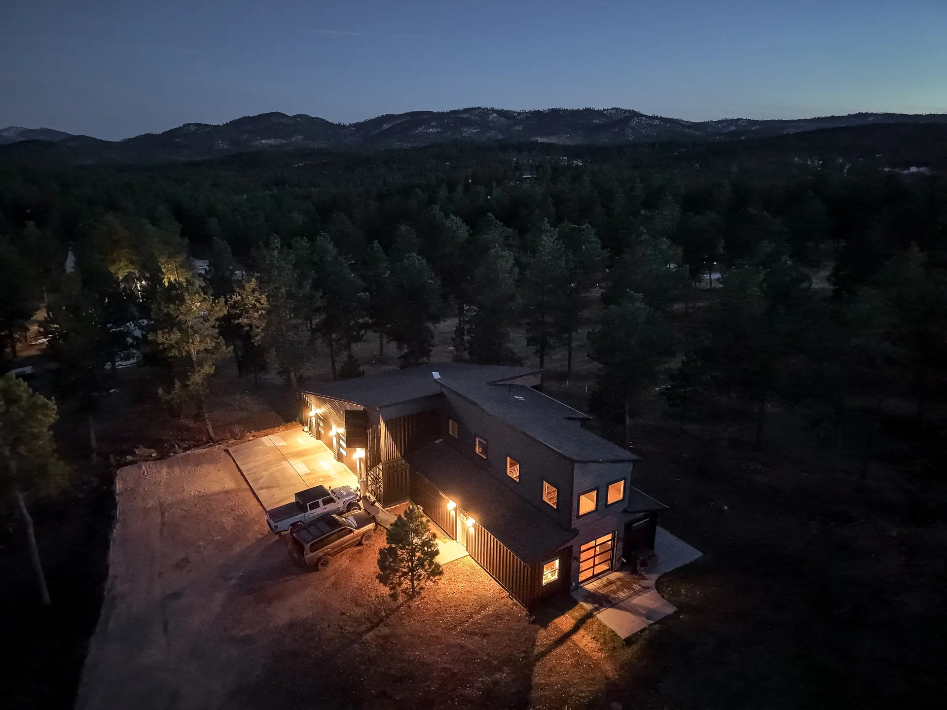 Custom container home in the Black Hills at dusk, built by Black Hills Property Solutions
